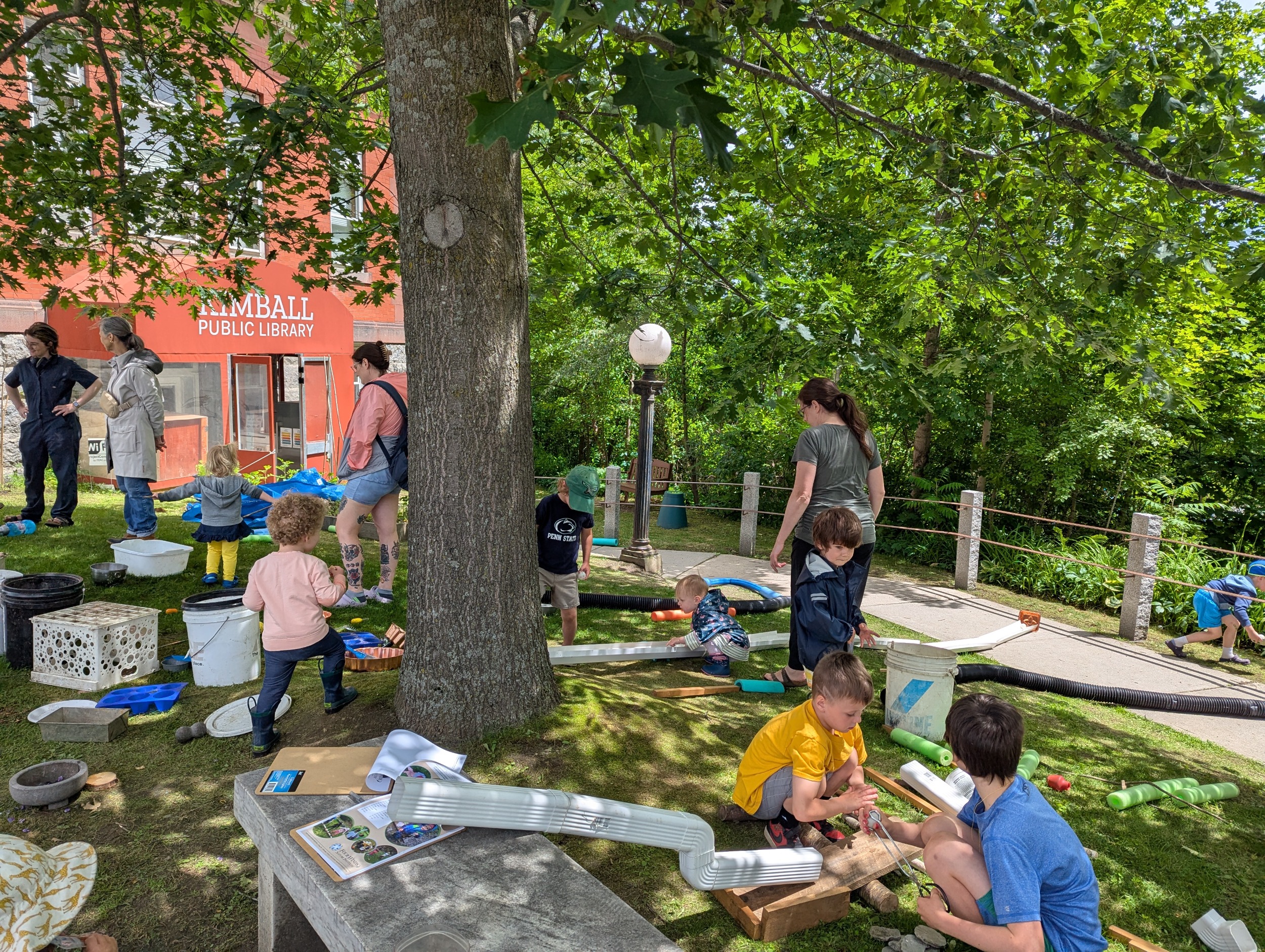 kids playing on the lawn outside Kimball Library